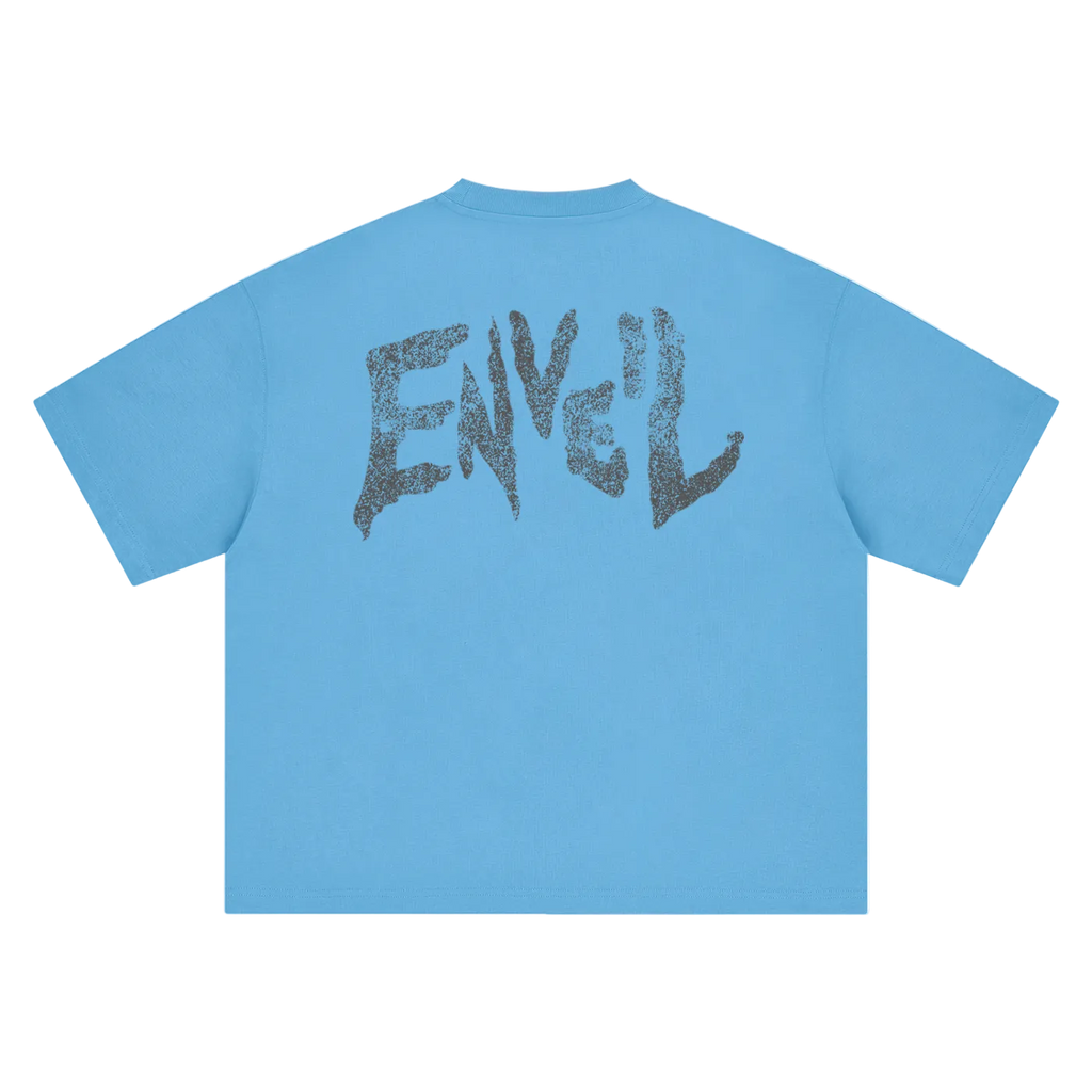 A sky blue short-sleeve t-shirt shown from the back, featuring a large distressed dark grey graphic spelling 'ENVEIL' across the upper back.