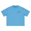 A sky blue short-sleeve crewneck t-shirt with a distressed dark grey 'ENVEIL' graphic printed on the left chest, displayed flat against a solid white background.