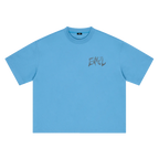 A sky blue short-sleeve crewneck t-shirt with a distressed dark grey 'ENVEIL' graphic printed on the left chest, displayed flat against a solid white background.